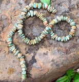 A large variety of shapes and colors in this strand on Kingman Turquoise chips.