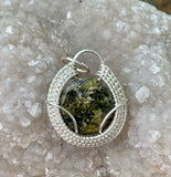 Green Tourmaline Pendant in wire wrapped Sterling (.925) and Fine (.999) Silver. 