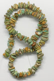 A large variety of shapes and colors in this strand on Kingman Turquoise chips.