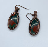 Beautiful deep green and bright red bloodstones wrapped in hand woven copper. These earrings are on Nobium ear wires. Niobium is naturally hypoallergenic, making this ear wire especially suited for customers with metal sensitivities.