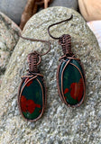 Beautiful deep green and bright red bloodstones wrapped in hand woven copper. These earrings are on Nobium ear wires. Niobium is naturally hypoallergenic, making this ear wire especially suited for customers with metal sensitivities.