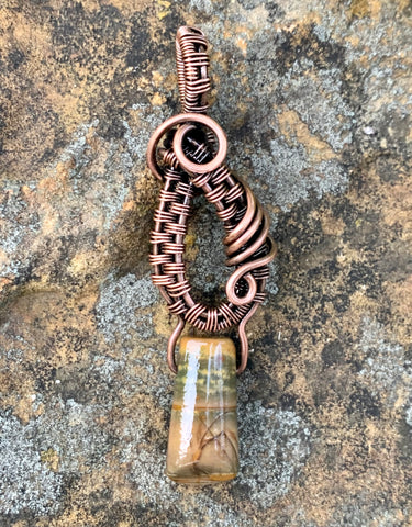 Wire Wrapped Copper Setting holds a Trapezoid Picasso Jasper Bead in this Pendant.