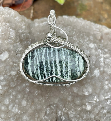 Chrysotile in Serpentile ( also known as Swiss Opal) Pendant in wire wrapped Argentium Silver.