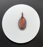 Colorful Agate Pendant in Wire Wrapped Copper with Carnelian Bead Accents. A vibrant one of a kind piece. 