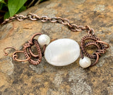 Shiny Mother of Pearl Bracelet with two Pearls and wire wrapped Copper.
