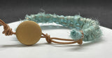 Adjustable Sari Silk Ribbon, Leather and Czech Glass Bead Bracelet in lovely light turquoise colors.