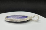 Beautiful Purple Tiffany Stone set in handwoven Sterling (.925) and Fine (.999) Silver.  