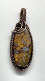 Brilliantly Colored Lace Agate Pendant in wire wrapped copper.