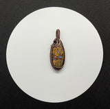 Brilliantly Colored Lace Agate Pendant in wire wrapped copper.