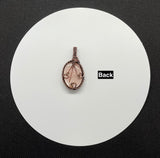 Shimmering, Carved Peach Moonstone Pendant in Wire Wrapped Copper with Copper Leaves Accent.