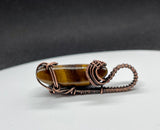 Lovely Striped Golden Tiger Eye Moon Pendant wrapped in handwoven Copper and then given a patina to match the colors in the stone.