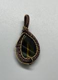 Blue and Yellow Tiger Eye Pendant in Brass and wire wrapped Copper.