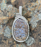 Gorgeous Blue Fossilized Dinosaur Bone Pendant in wire wrapped Sterling (.925) and Fine (.999) Silver. 