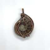 Fascinating Ammonite Fossil Pendant in wire wrapped Copper. 