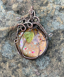 One of a kind Hand Painted Glass Pumpkin Pendant in Square Copper Wire with Green Glass Leaf Bead Dangle. The Perfect Accessory for Fall!