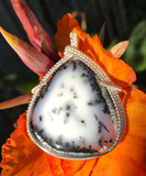 This stunning statement piece features a large Dendritic Agate Pendant wrapped in Sterling Silver.