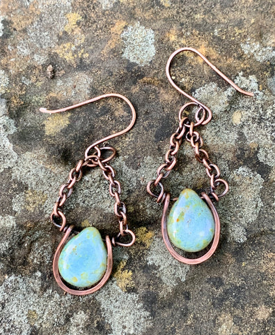 Beautiful blue with a touch of green Czech Glass drops, surrounded by hammered copper. These are dangling from copper chain and hang on handmade ear wires.