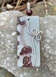 Burgundy and Gray Chohua Jasper Pendant in Argentium Silver with a Garnet Accent. 