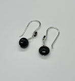 These Sterling Silver Earrings feature a faceted Spinel and Black Agate drops. 