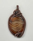 Colorful Striped Agate Pendant in Wire Wrapped Copper. 