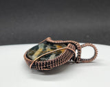 Beautiful Scenic Jasper Pendant in copper has shades of blue, yellow and brown. 