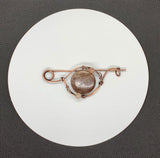 Hand formed Copper Pin with a dark (almost purple) Sunstone focal and smaller Sunstones around it.